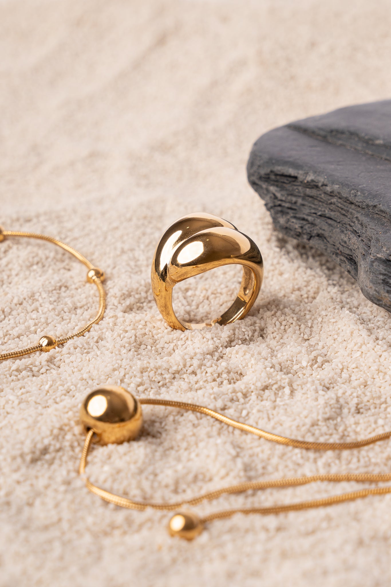 Anillo entrelazado dorado de acero mujer