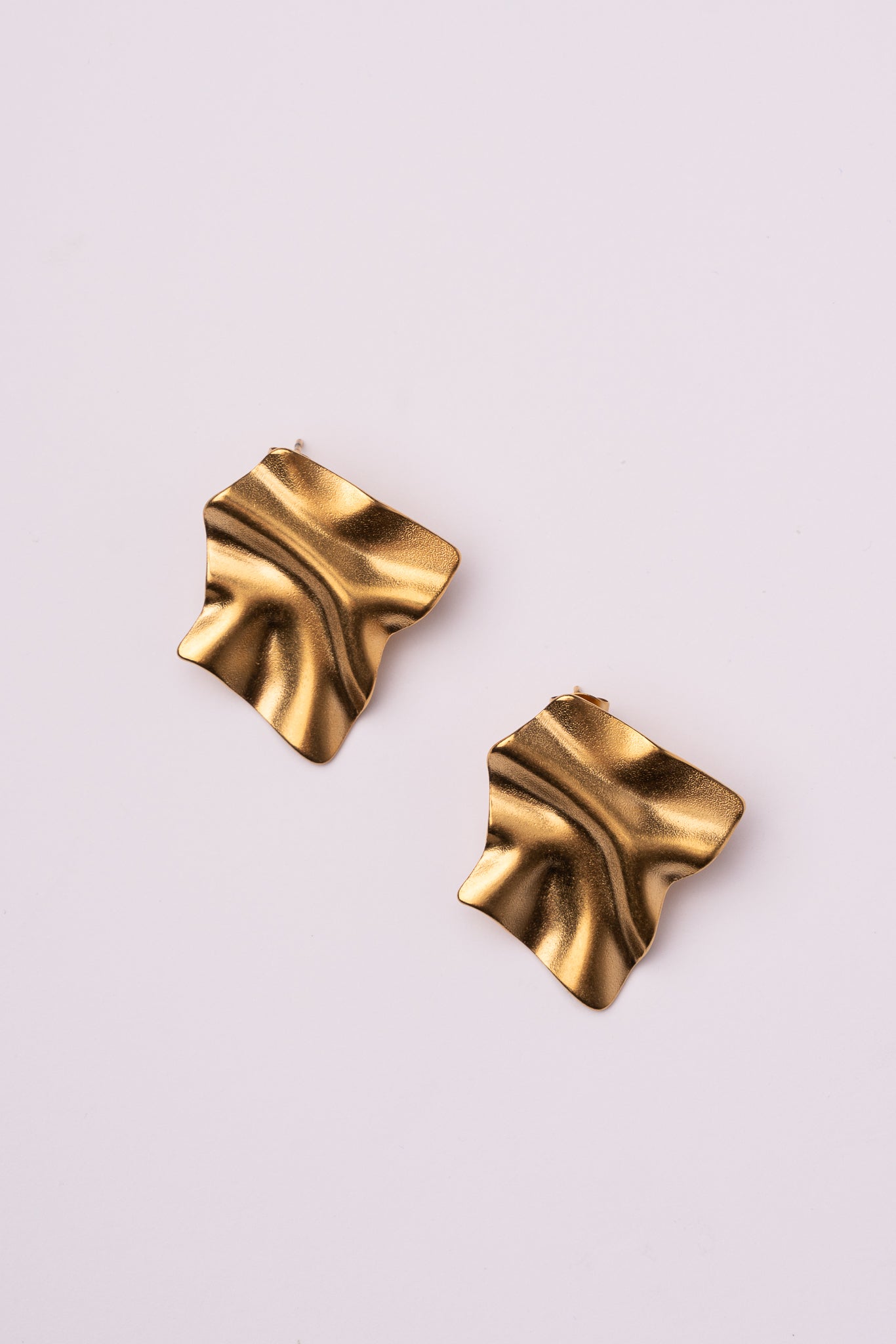 Pendiente forma abstracta acero oro 18k mujer