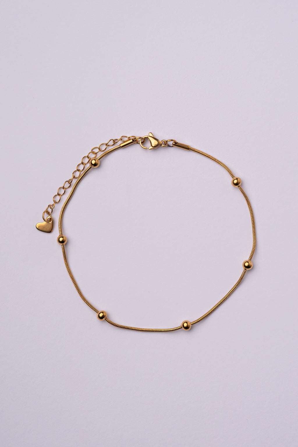 Tobillera bolas acero oro 18K mujer