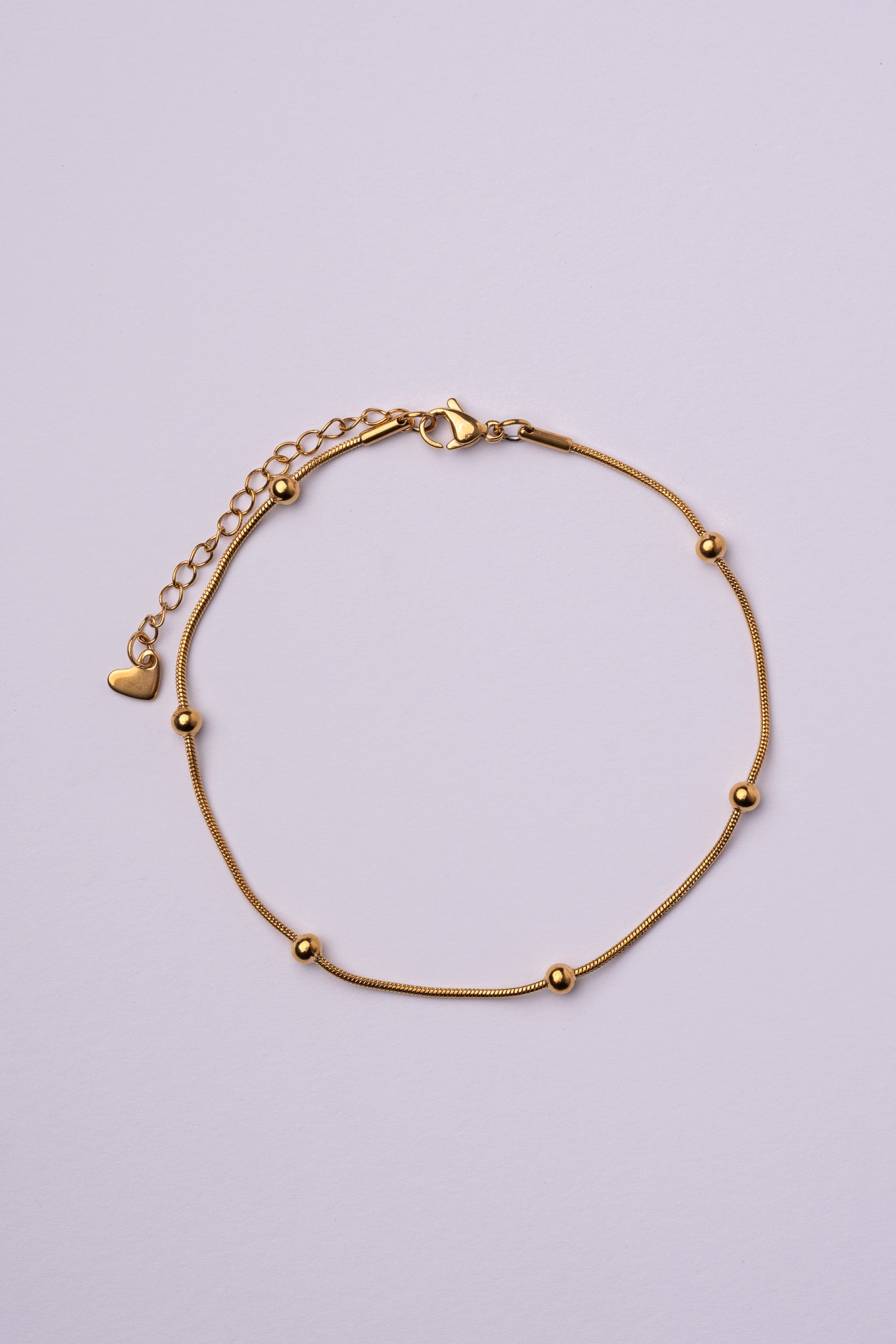Tobillera bolas acero oro 18K mujer