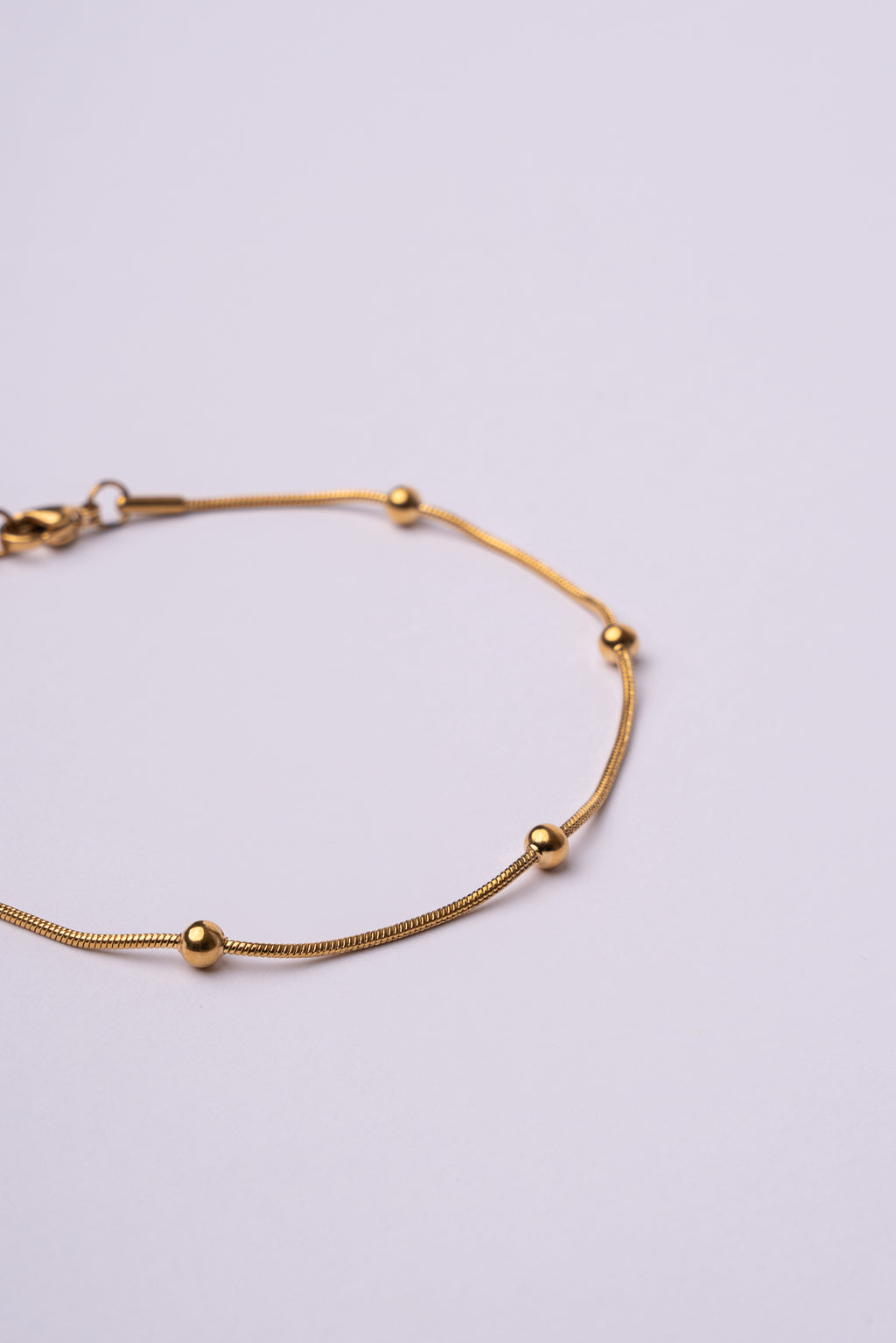 Tobillera bolas acero oro 18K mujer