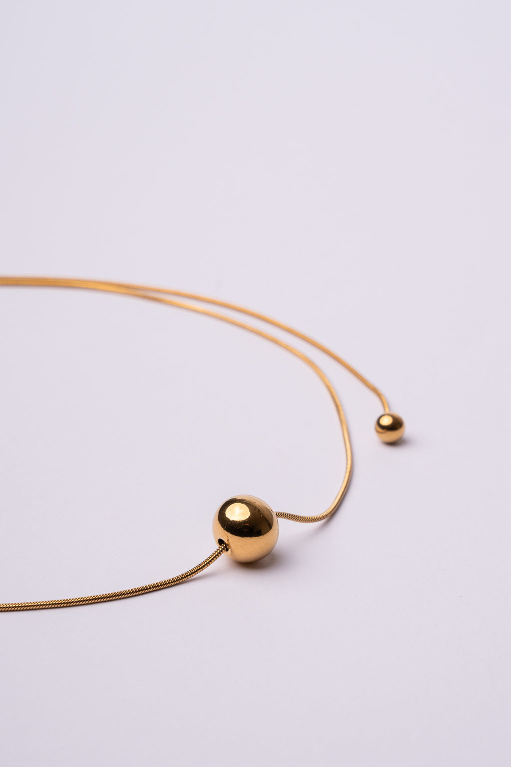 Collar bola espalda acero oro 18k mujer