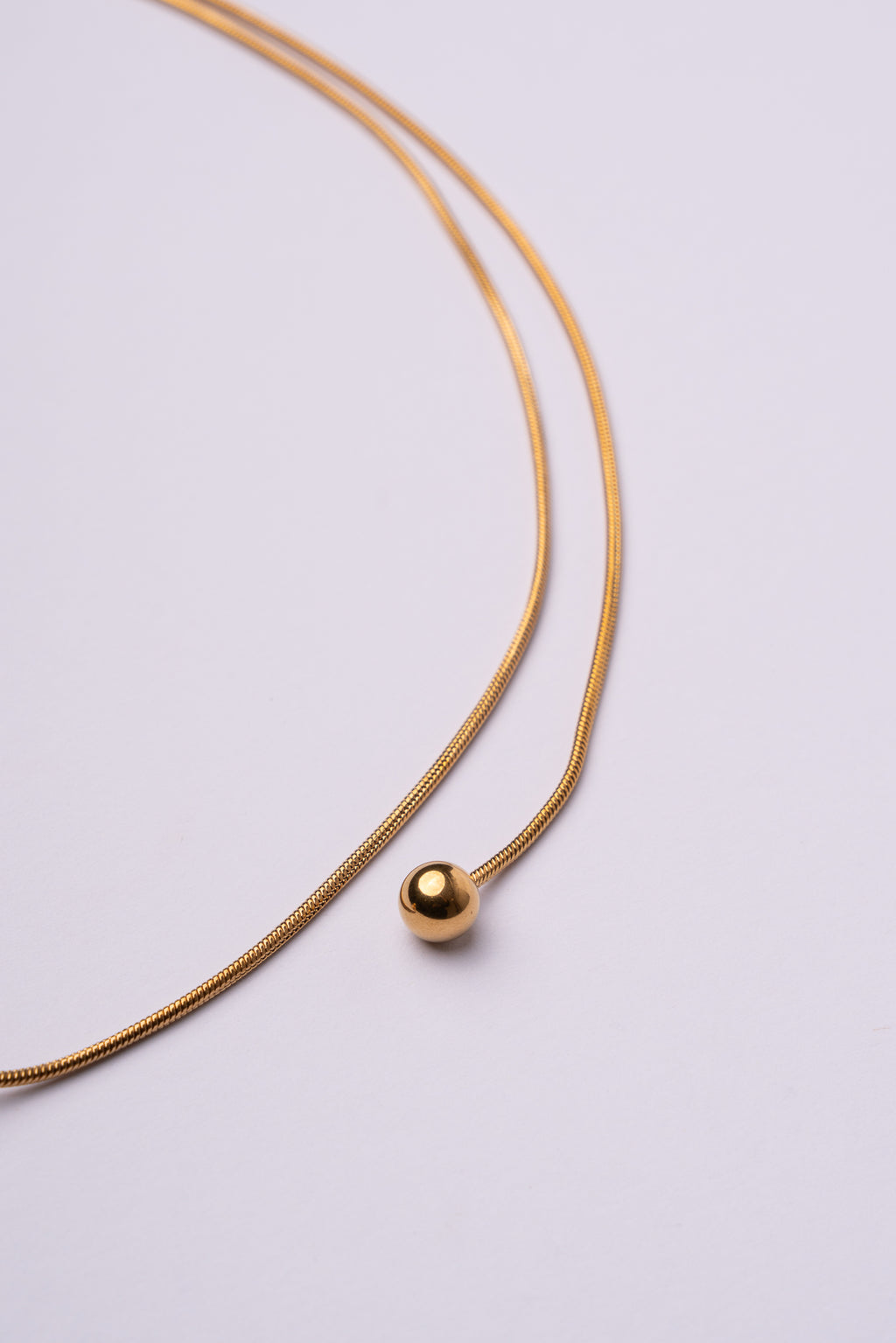 Collar bola espalda acero oro 18k mujer