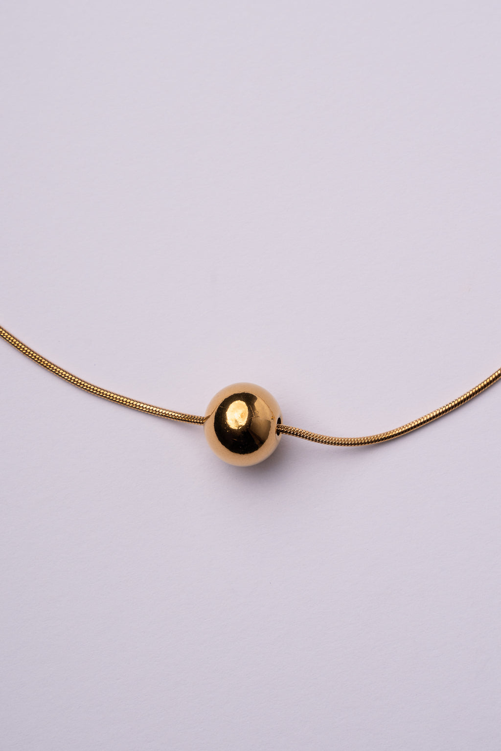 Collar bola espalda acero oro 18k mujer