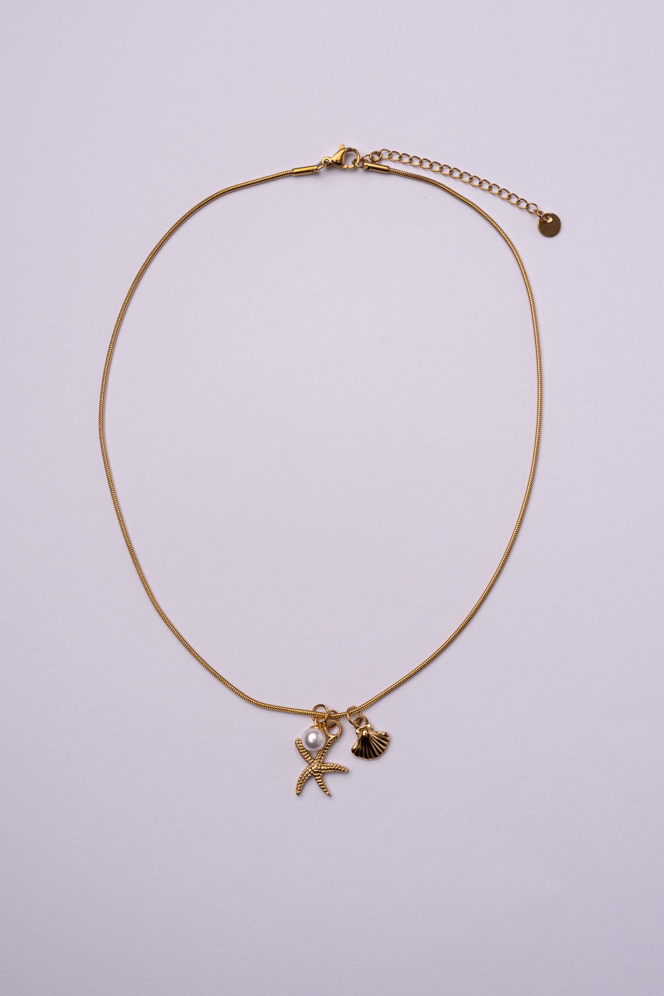Collar estrella de mar y concha acero oro 18k mujer