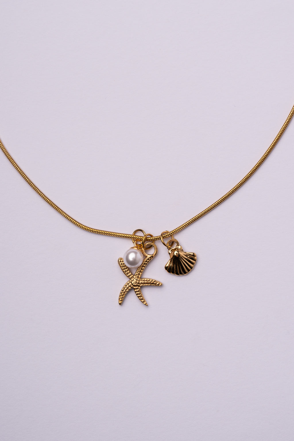 Collar estrella de mar y concha acero oro 18k mujer