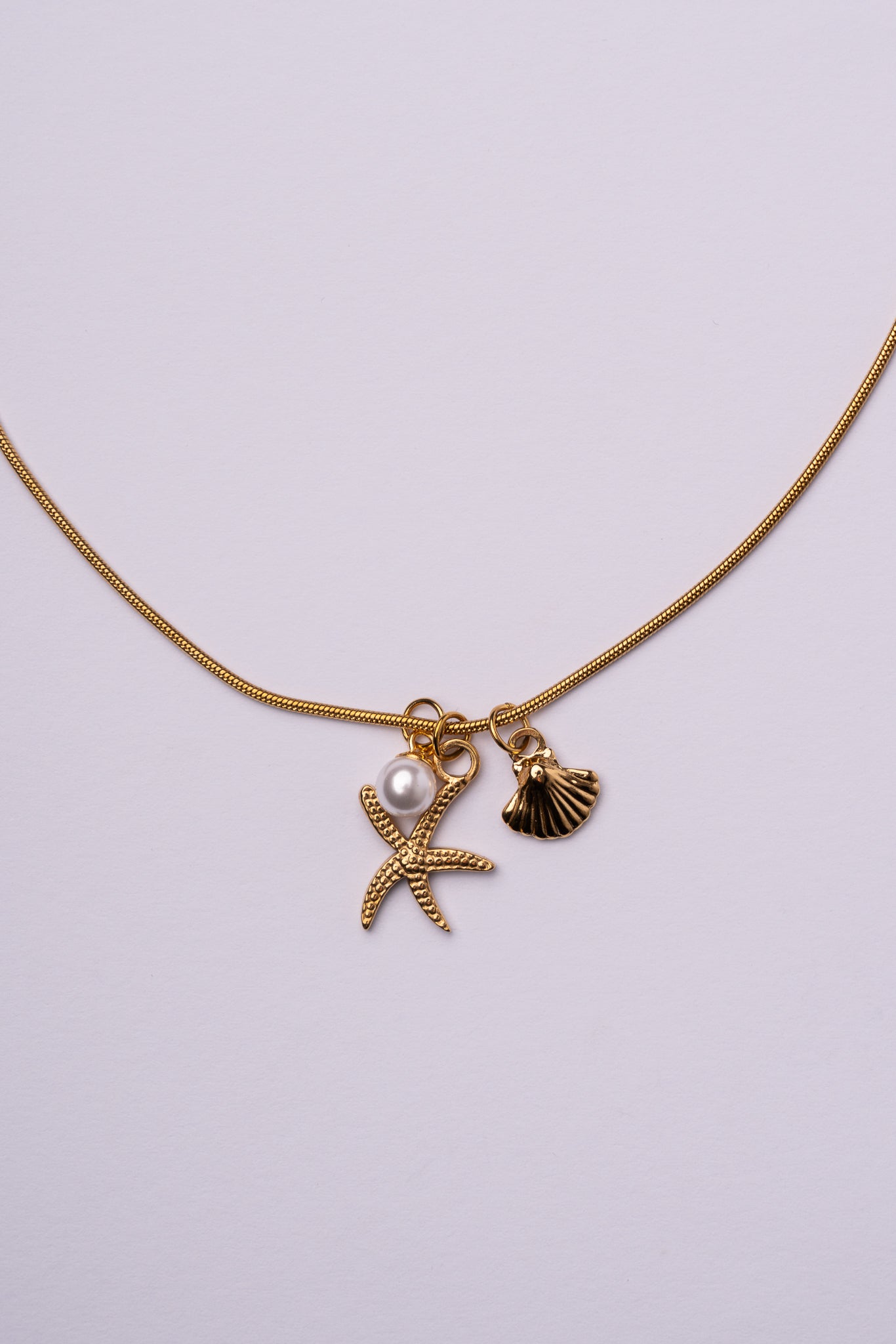 Collar estrella de mar y concha acero oro 18k mujer