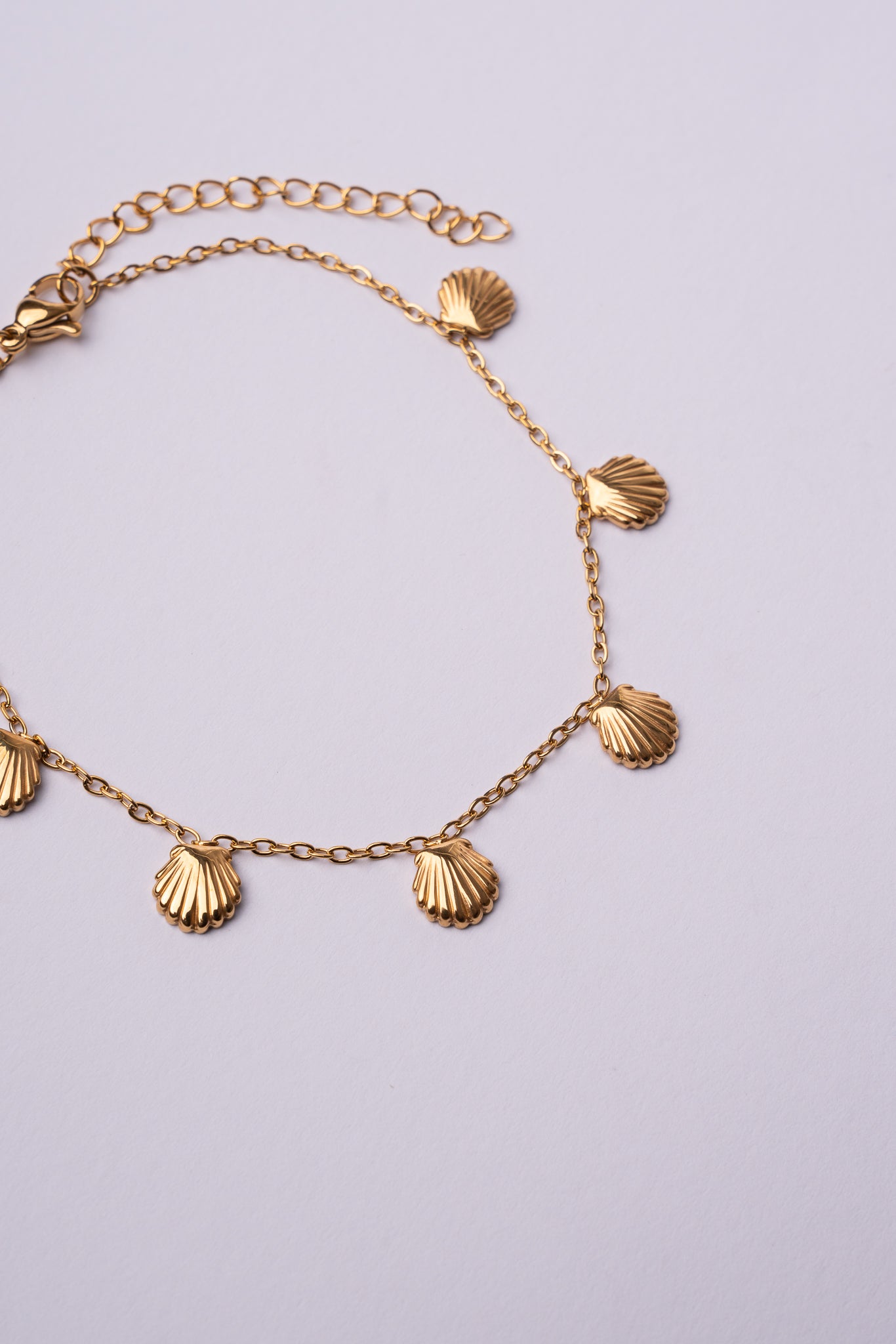 Tobillera conchas acero oro 18K mujer