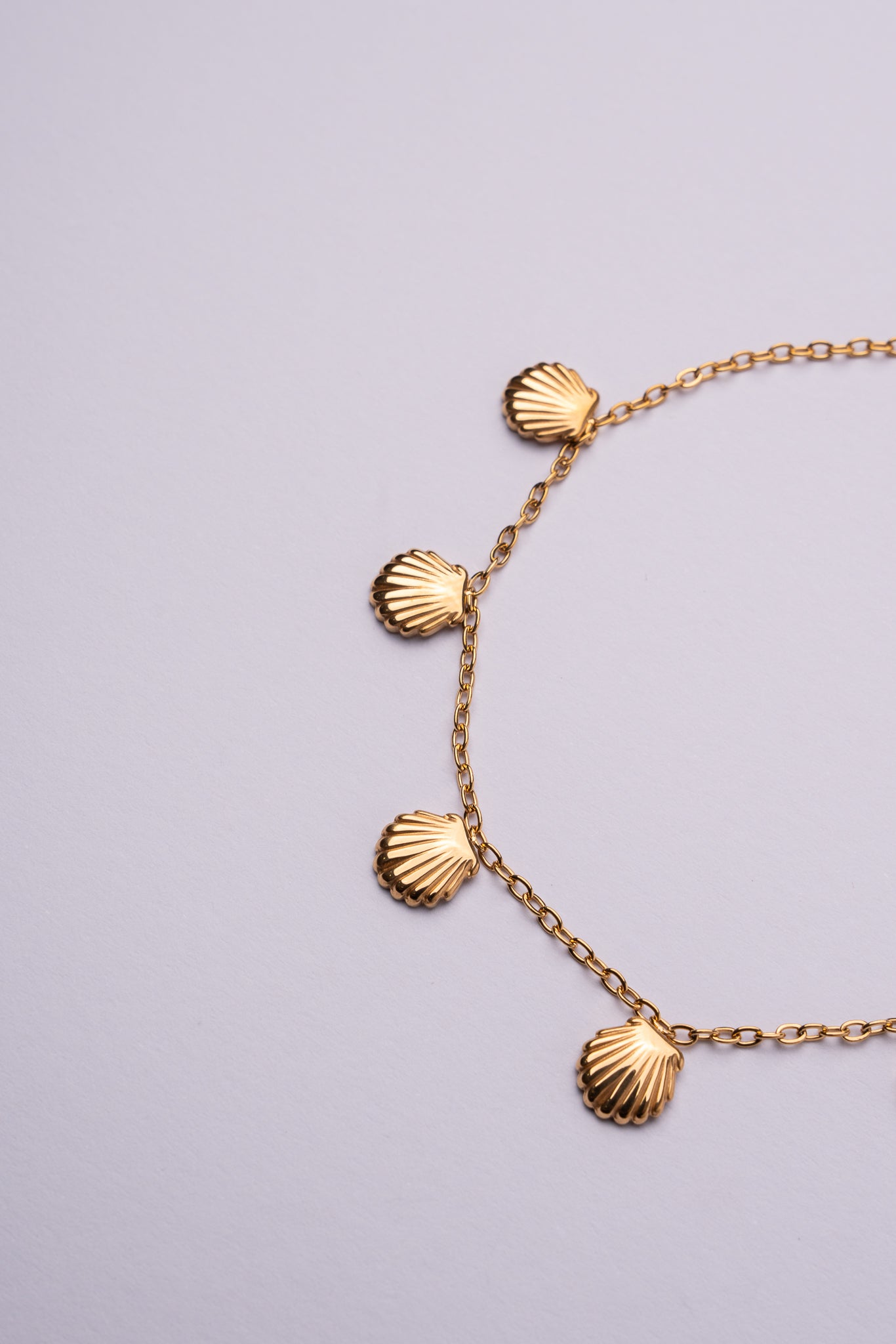 Tobillera conchas acero oro 18K mujer